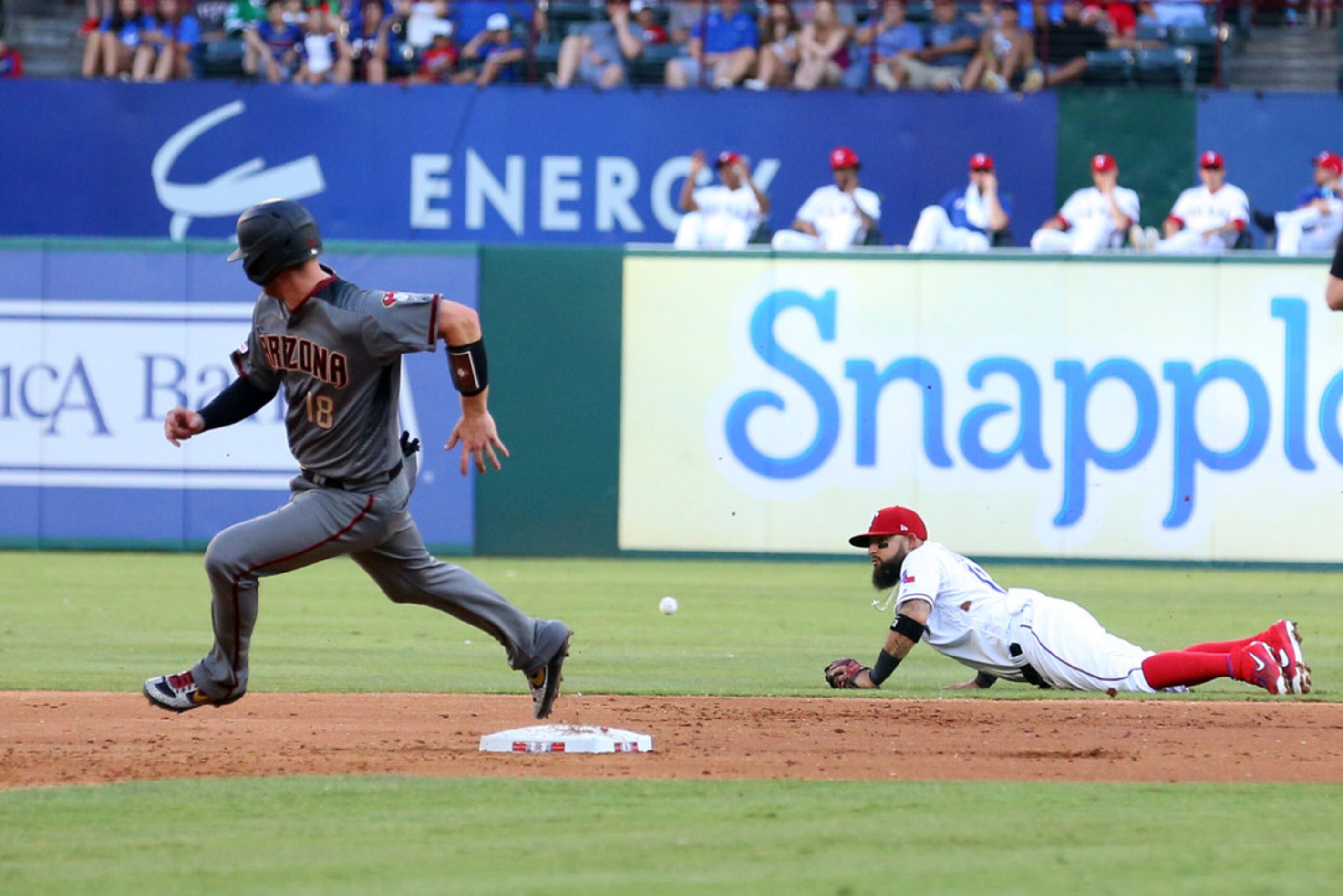 Arizona Diamondbacks Carson Kelly (18) rounds second as the ball hit by Jarrod Dyson gets...