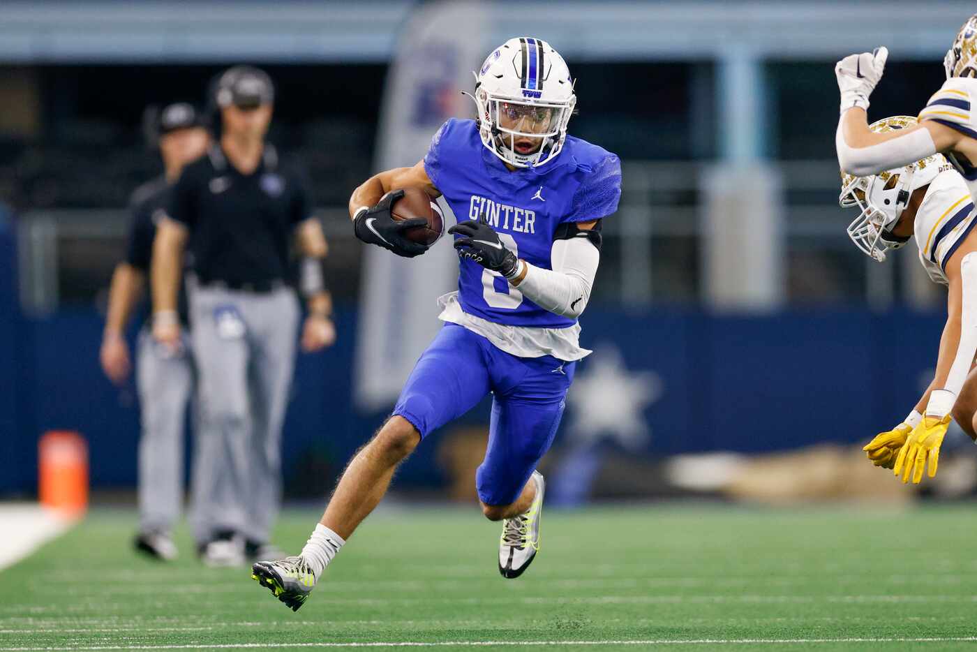 Gunter running back Ethan Sloan (8) runs after a catch during the first half of the Class 3A...