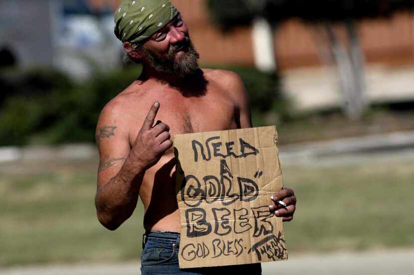 
A file photo shows a man panhandling near the intersection of I-35 and Northwest Highway.
