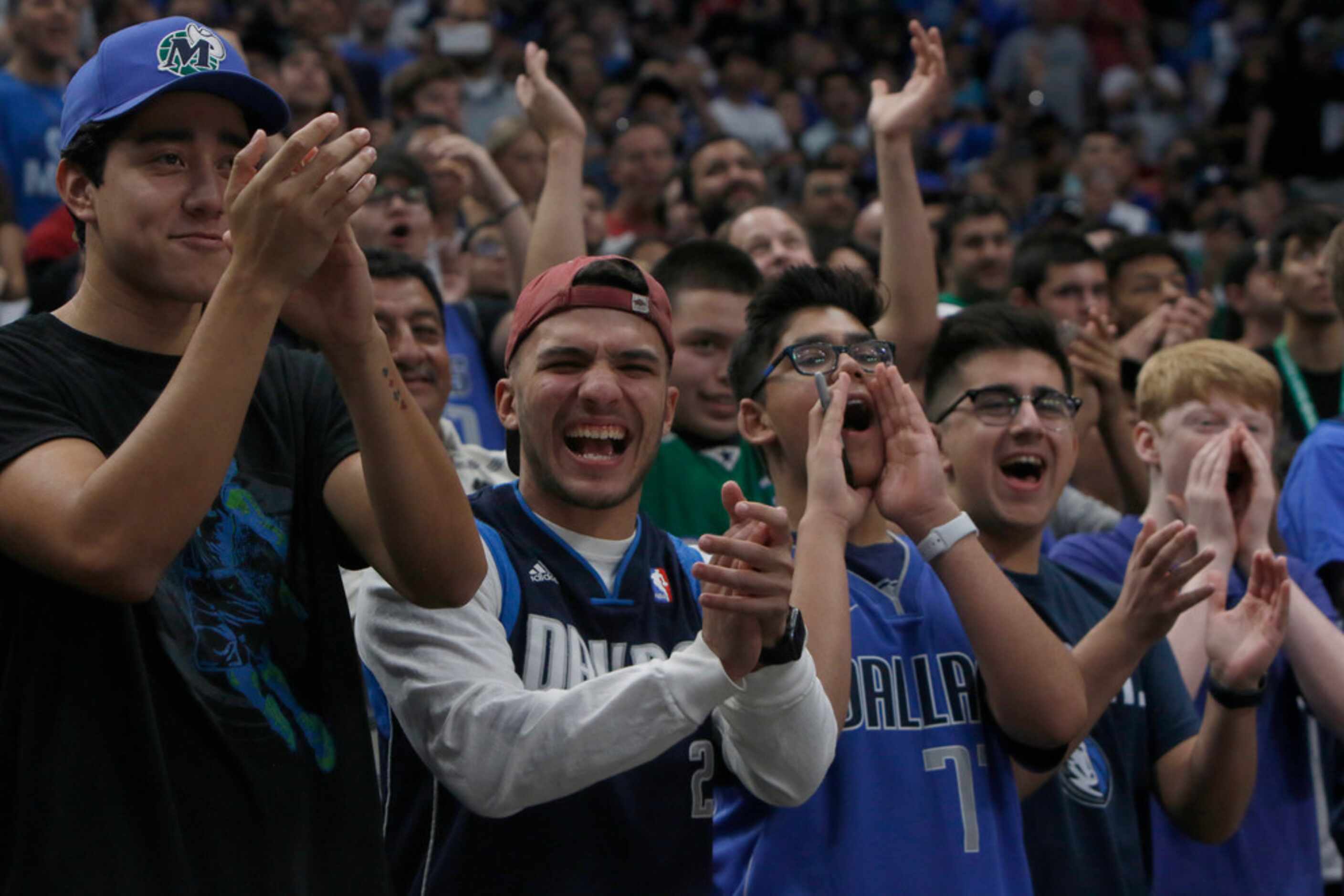 Dallas Mavericks fans exult as players are announced prior to the start of  an intra-squad...