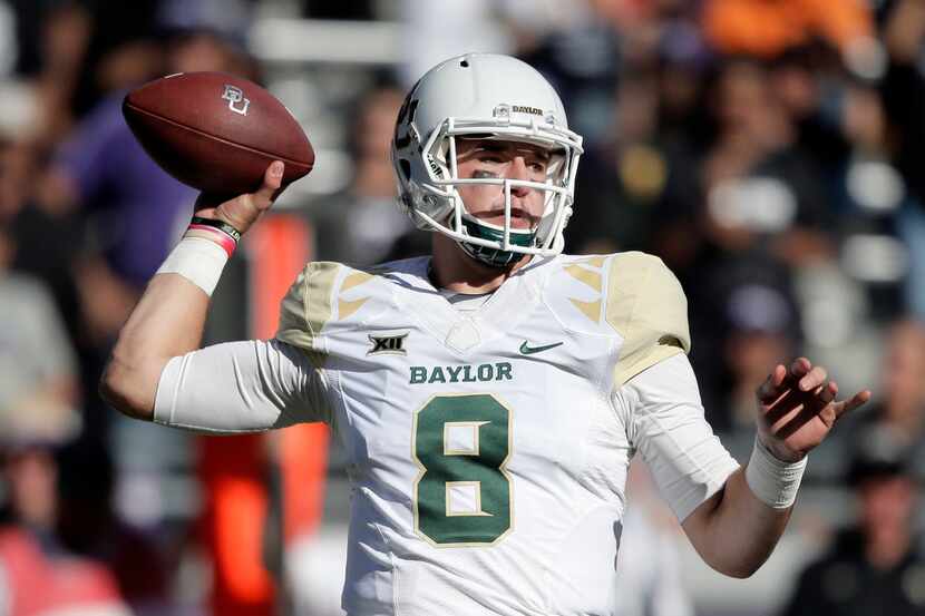 Baylor quarterback Zach Smith (8) throws during the second half of an NCAA college football...