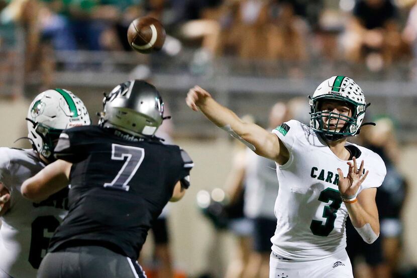Southlake Carroll's Quinn Ewers (3) attempts a pass in a game against Denton Guyer during...
