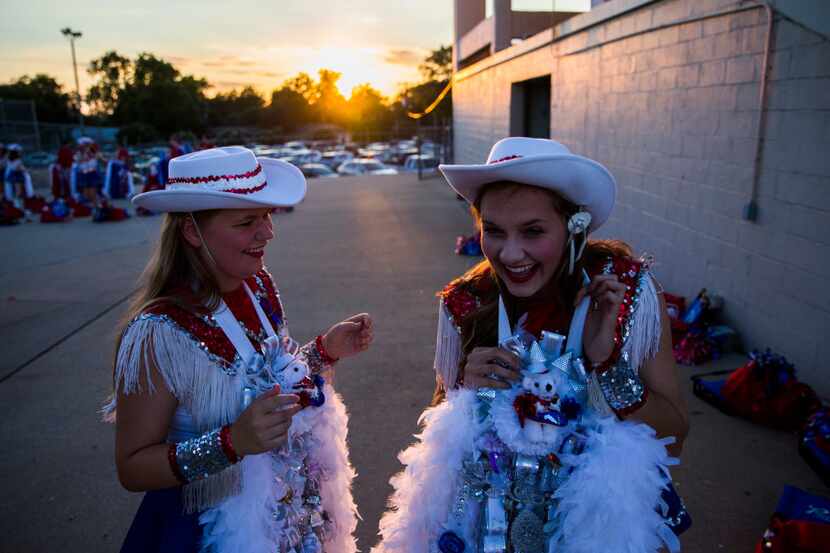 Richardson Pearce Pacesetters member Andre Ujcich, left, helps Hope Winters, right, with her...