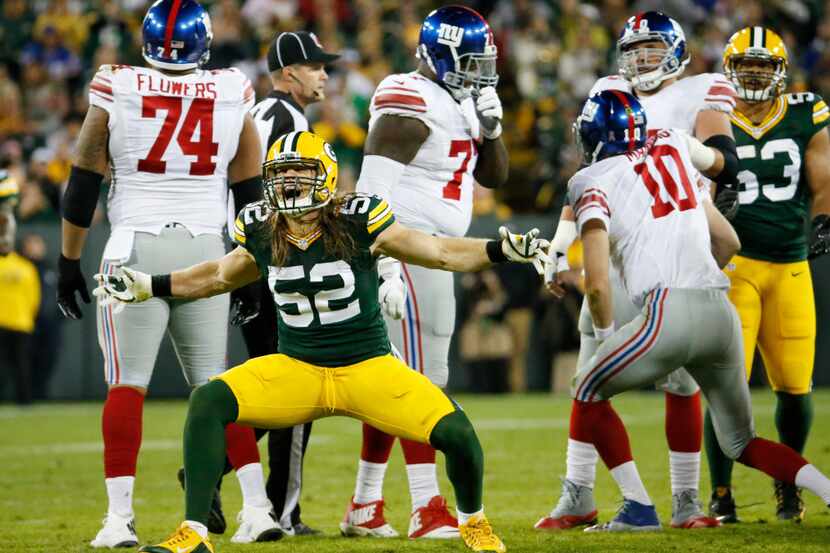 Green Bay Packers' Clay Matthews celebrates a sack of New York Giants quarterback Eli...