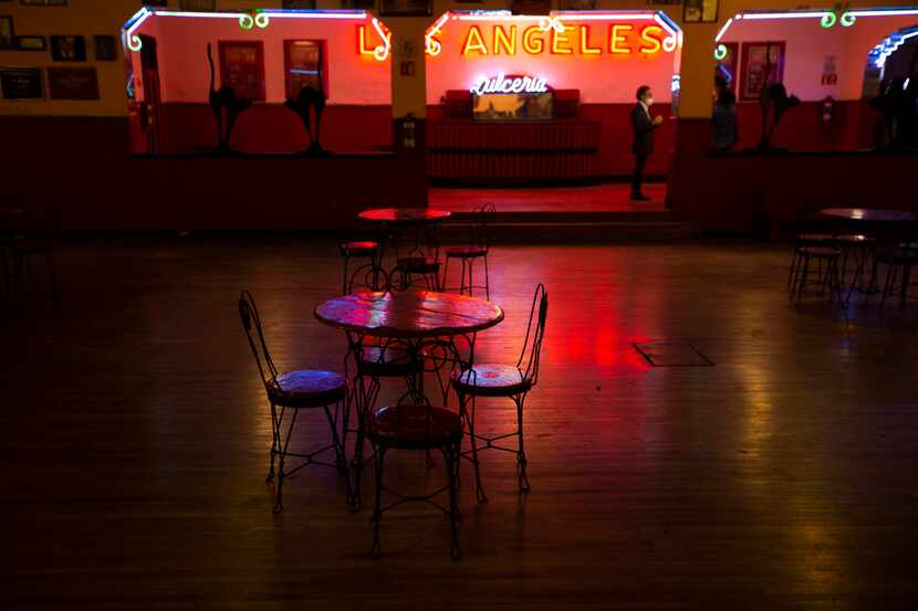 Tables and chairs sit empty at Mexico's Salon Los Angeles dance hall.