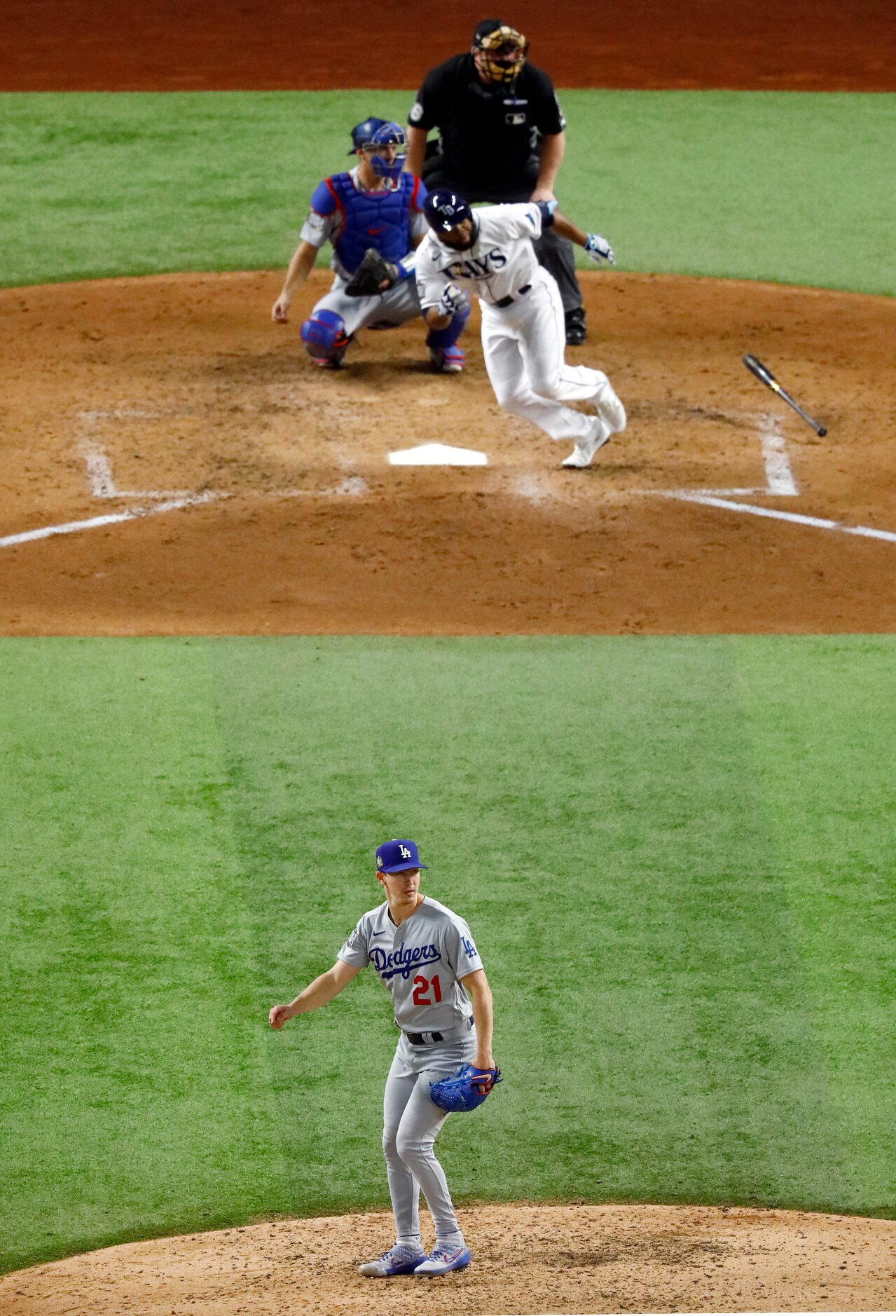 Los Angeles Dodgers starting pitcher Walker Buehler (21) watches Tampa Bay Rays batter...