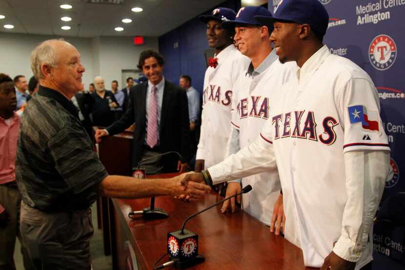 Nolan Ryan congratulates Texas Ranger draft picks that they signed (including L-R Akeem...