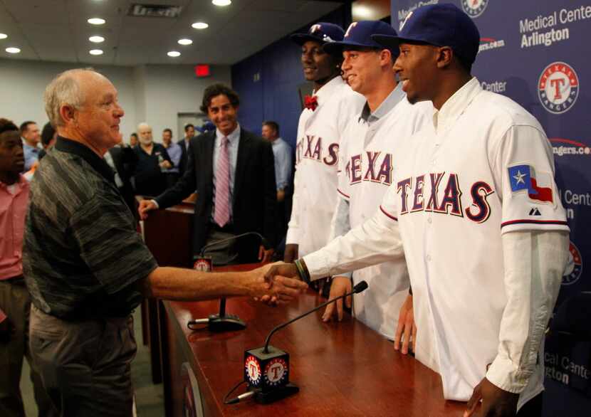 Nolan Ryan congratulates Texas Ranger draft picks that they signed (including L-R Akeem...