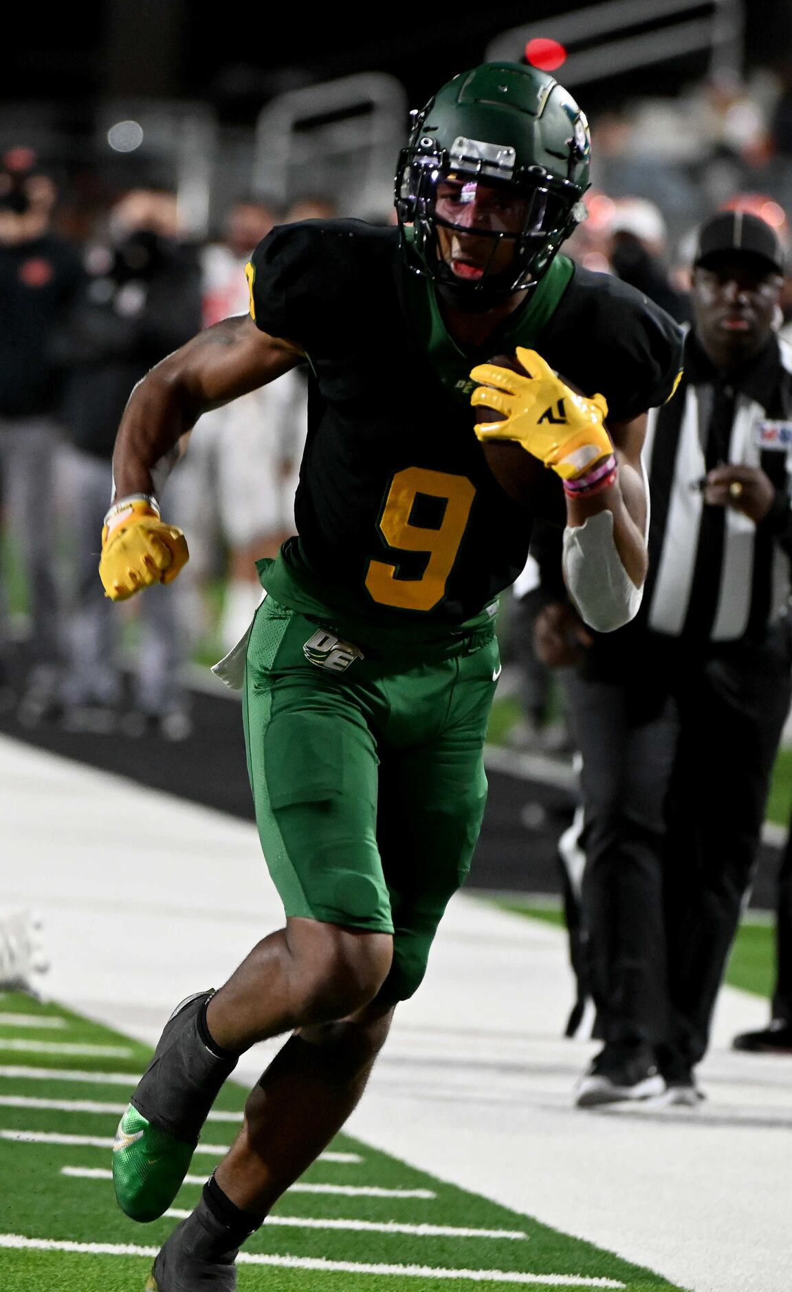 DeSoto’s Jerand Bradley runs upfield after a catch in the first half of a Class 6A Division...
