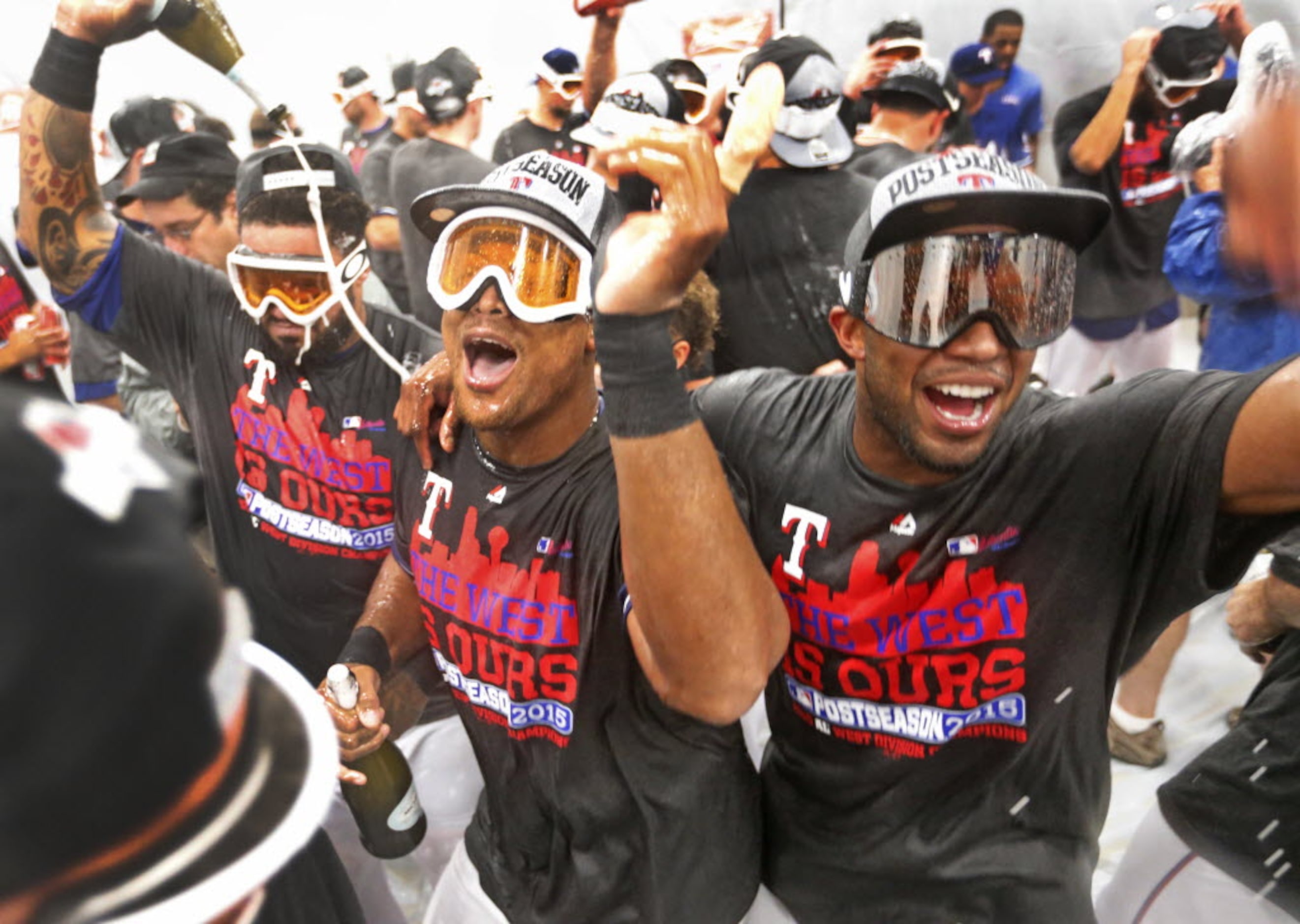 Texas Rangers Prince Fielder, left, Adrian Beltre and Elvis Andrus dance together in the...