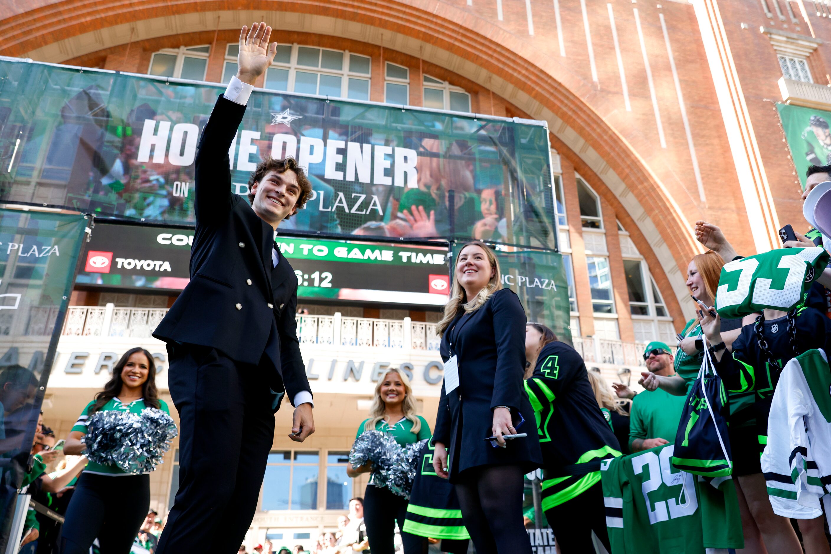 Dallas Stars center Wyatt Johnston waves back towards the crowd during the team’s home...