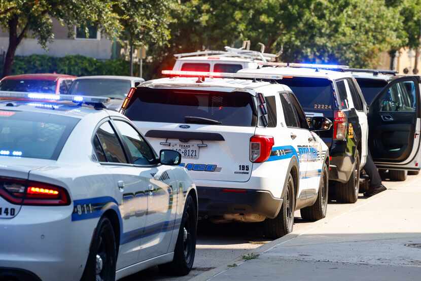 Dallas Police officers prepare for a caravan down to Houston and help the city amid its...