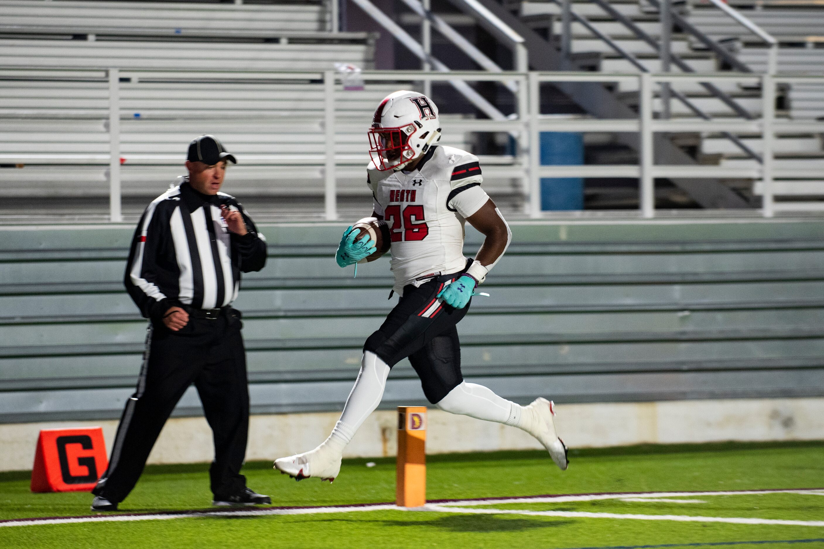 Heath senior Zach Evans (26) crosses into the end zone to score a touchdown during a...