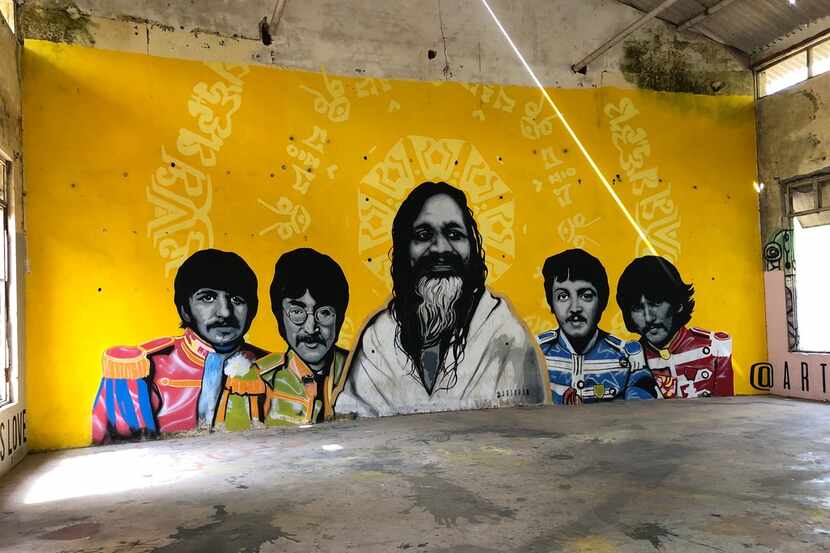 A mural in Rishikesh, India, shows the Beatles with the Maharishi Mahesh Yogi, their...