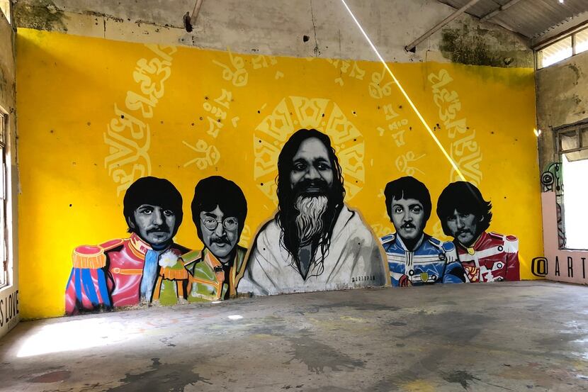 A mural in Rishikesh, India, shows the Beatles with the Maharishi Mahesh Yogi, their...