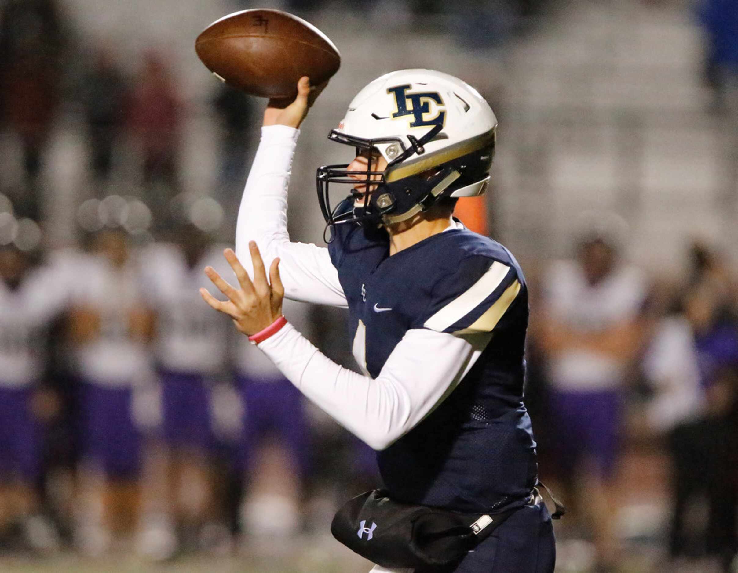 Little Elm High School quarterback John Mateer (4) throws a pass during the first half as...