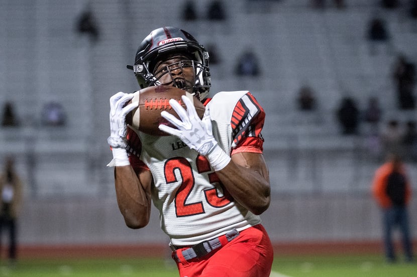 Mansfield Legacy junior wide receiver Ife Adeyi (23) hauls in a touchdown reception in the...