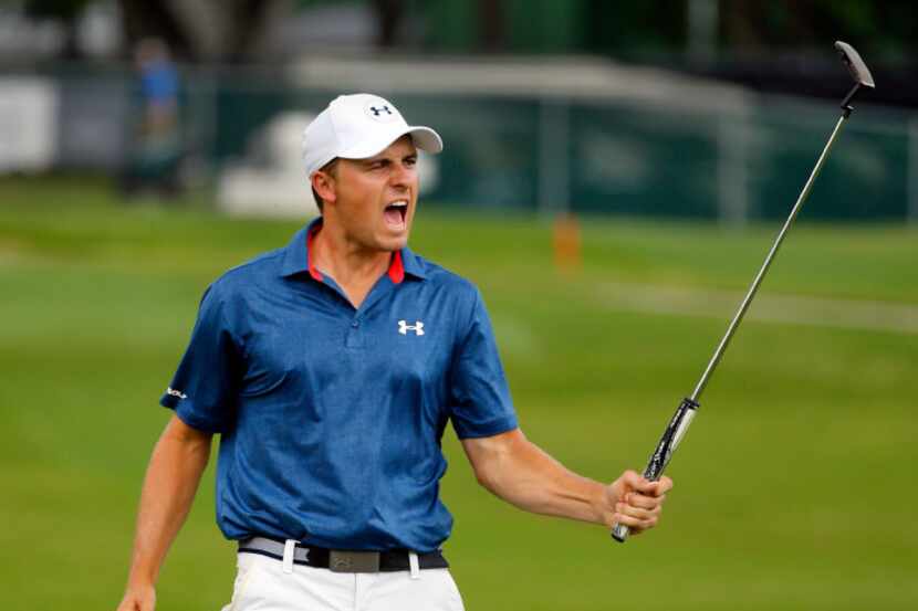 Jordan Spieth reacts after sinking his birdie on the par-3, No. 16 during the final round of...