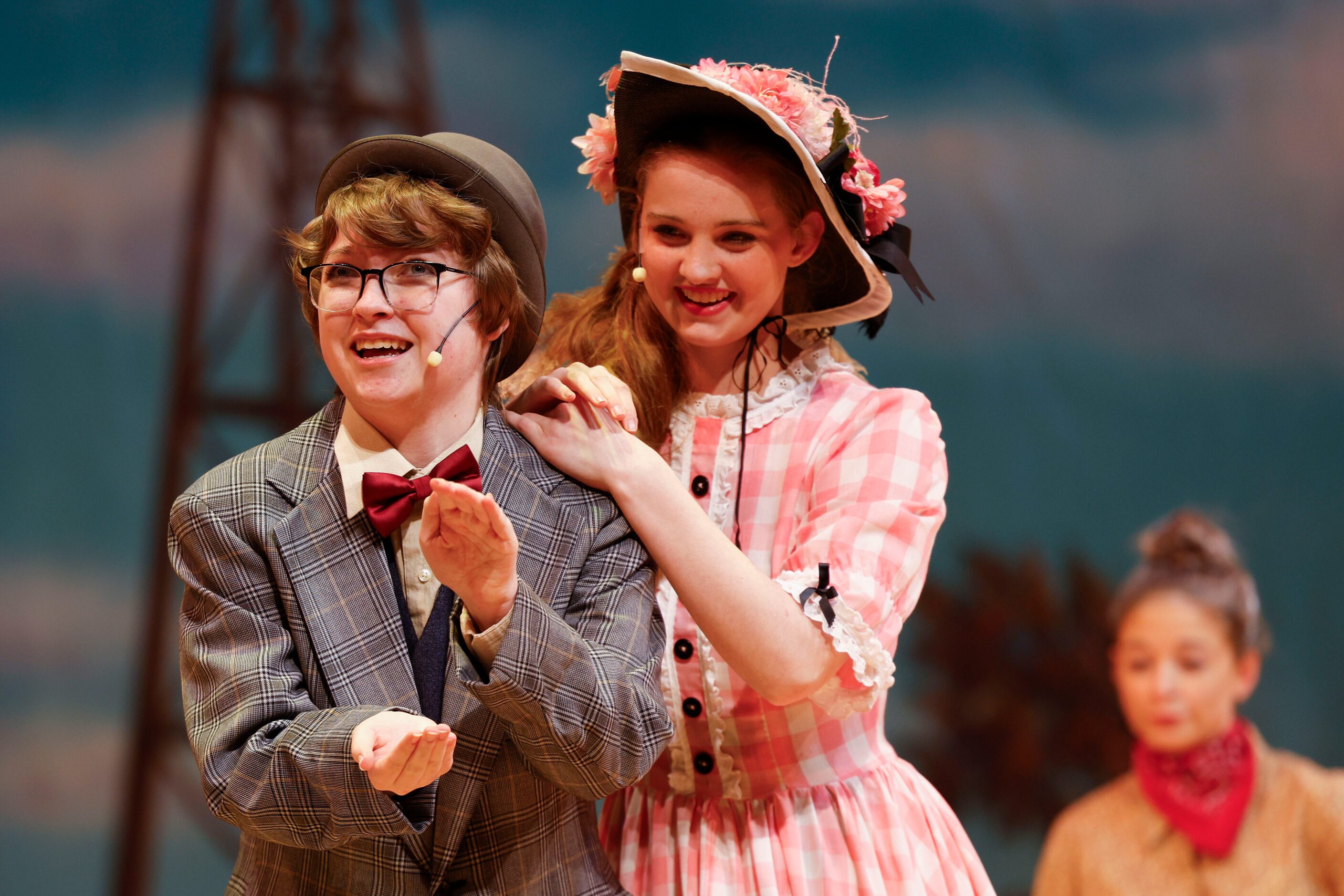 Cast member Max Hightower (left) as Ali Hakim, and Avery Tollison as Ado Annie act during...