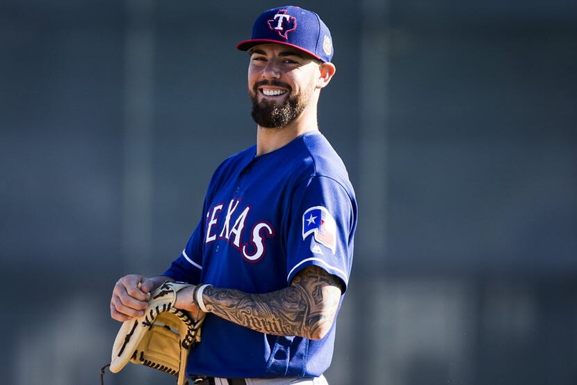 Texas Rangers pitcher Anthony Ranaudo prepares to participate in a fielding drill during a...