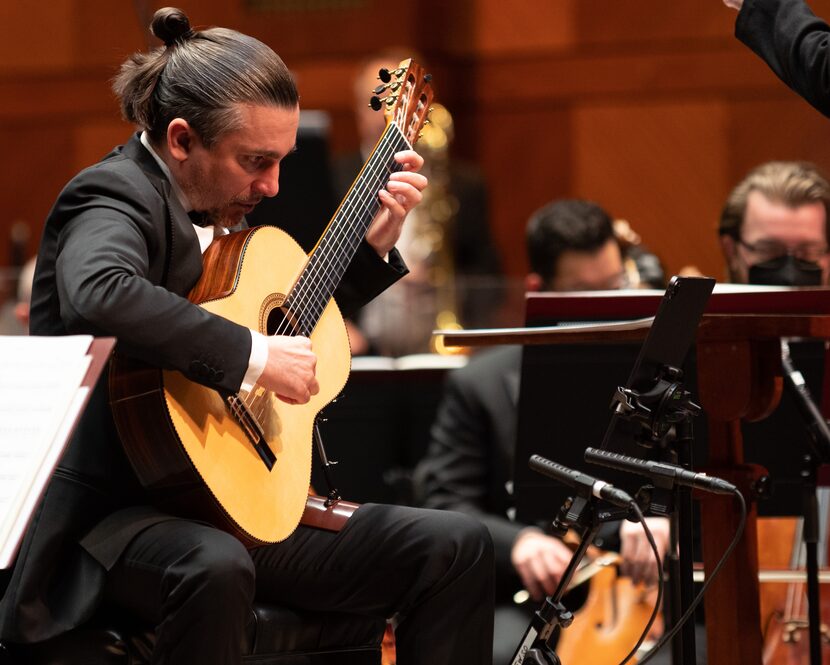 Guitarist Artyom Dervoed performs British composer Joby Talbot's 'Ink Dark Moon' with the...