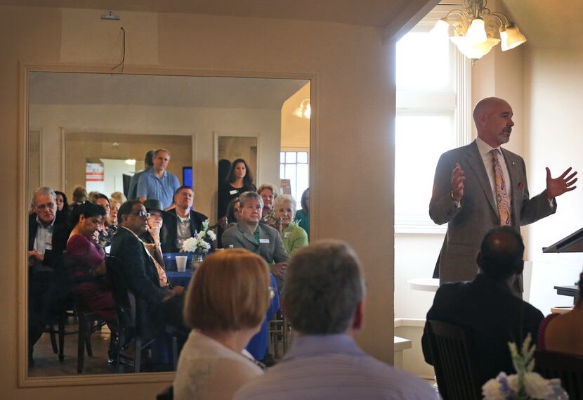 Mark Hagan, founder and president of Emily's Place Inc., talks with the crowd during...