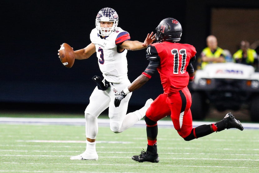 Ryan junior quarterback Spencer Sanders (3) stiff-arms Colleyville Heritage senior...