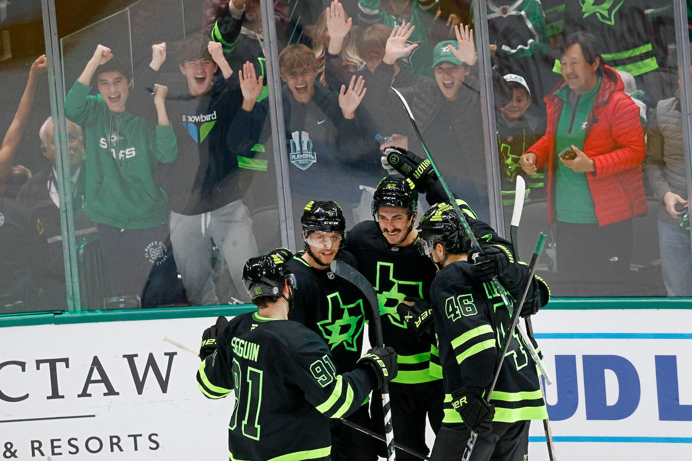 Dallas Stars left wing Mason Marchment (27), center, celebrates with his teammates after...