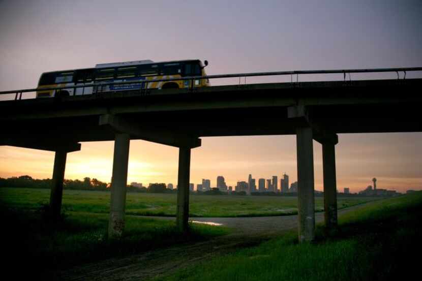 
A DART bus heads west in this 2008 file photo of the Dallas skyline.
