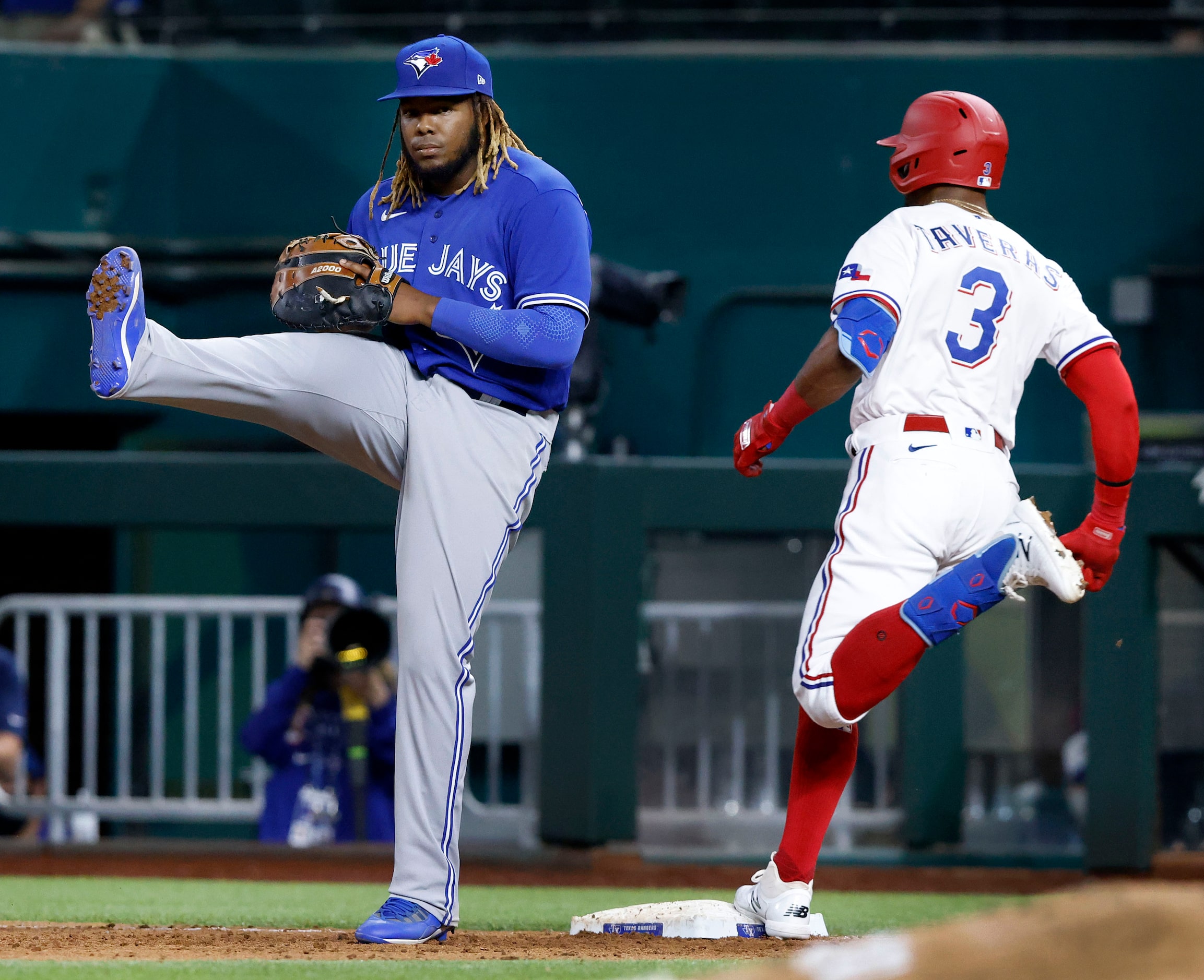 Toronto Blue Jays first baseman Vladimir Guerrero Jr. (27) gives a kick as Texas Rangers...