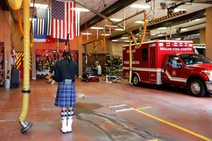 Jim Royer of the Dallas Fire Fighters Pipes & Drums plays the bagpipes during a September 11...