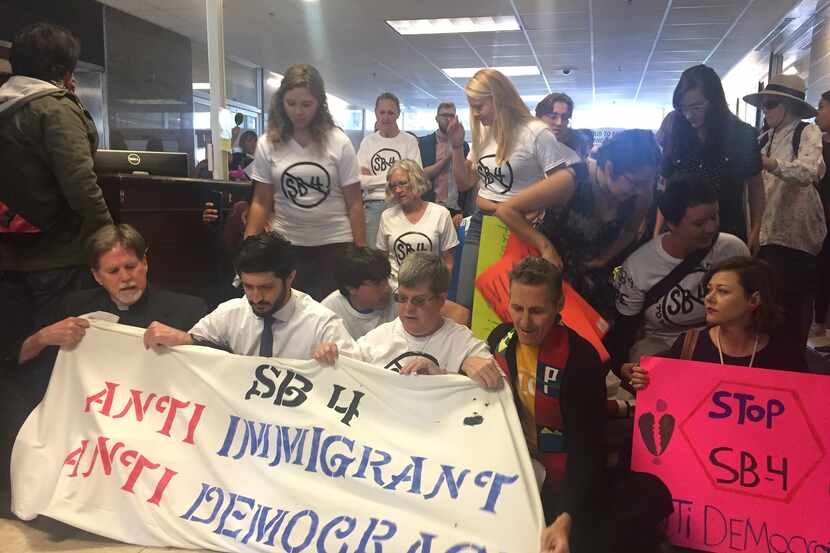 Protesters held a sit-in at Texas Gov. Greg Abbott's office on May 1 in opposition to Senate...