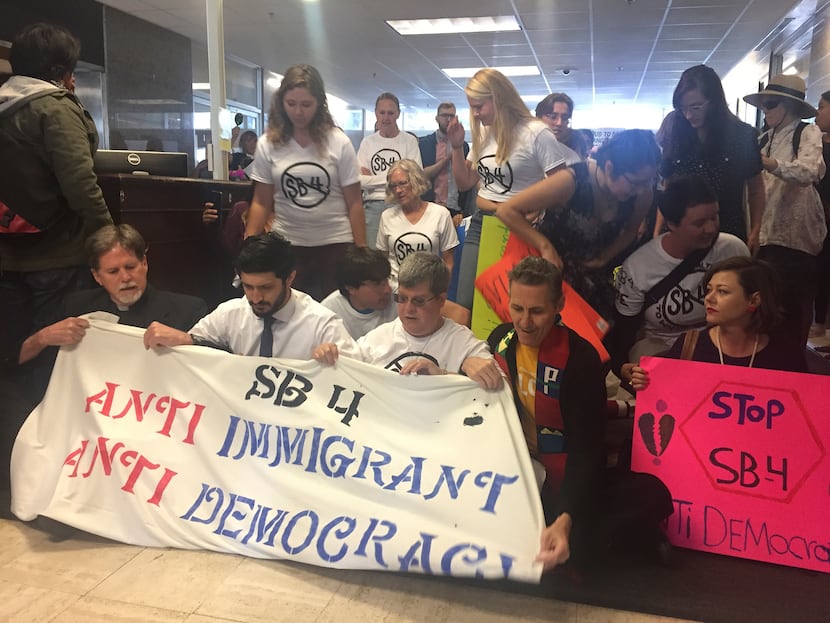 Protesters held a sit-in at Texas Gov. Greg Abbott's office on May 1 in opposition to Senate...