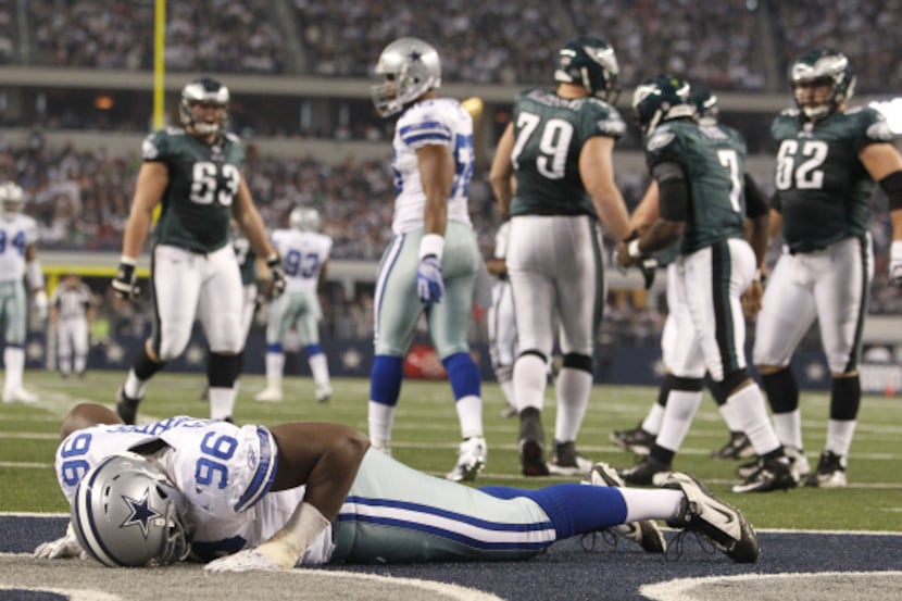 Dallas Cowboys defensive end Clifton Geathers (96) lies injured on the turf during first...