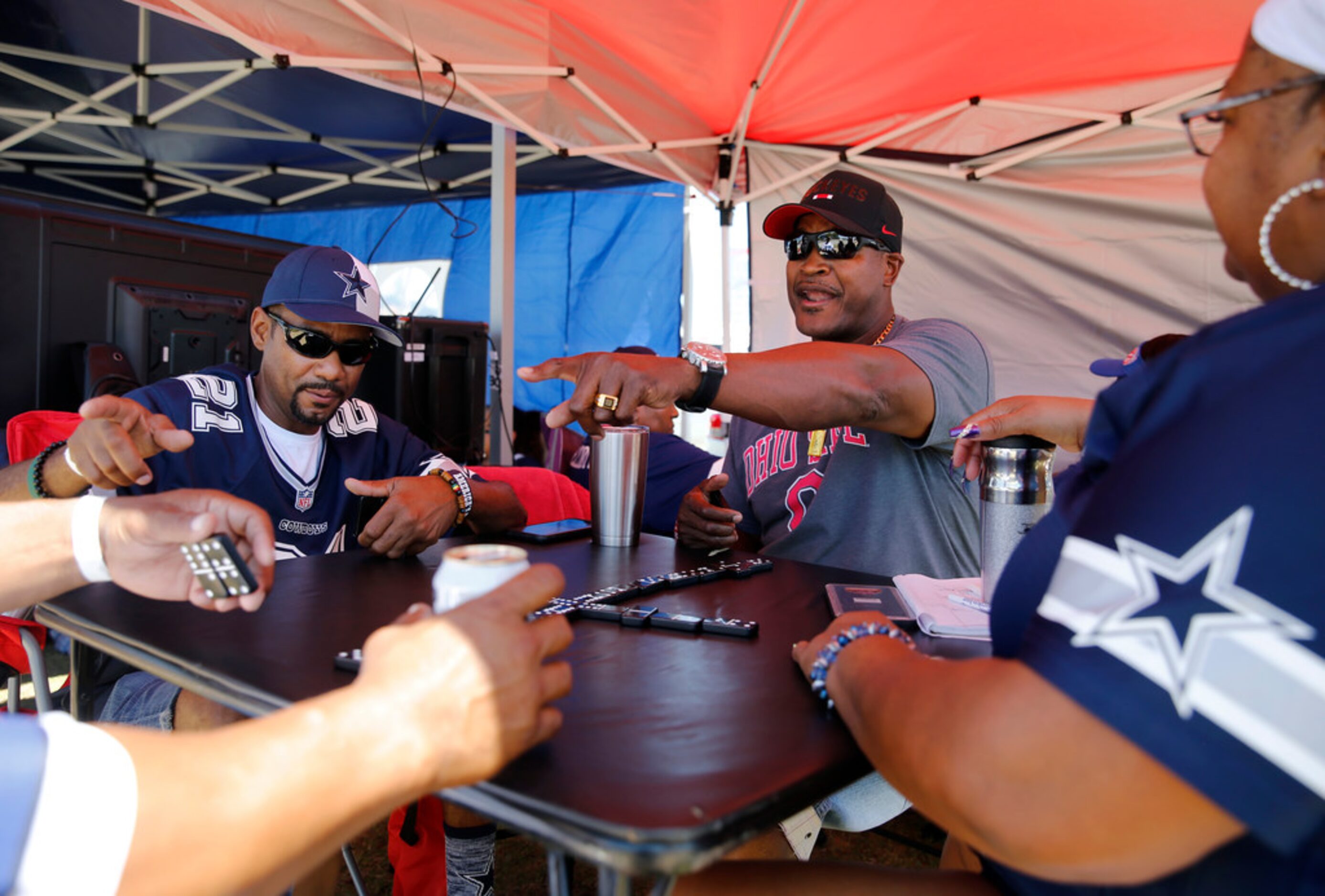 Alonzo Thomas (left), Tommy Spikes (center) and Yvette Wise (right) wait on Tracy Hall (far...