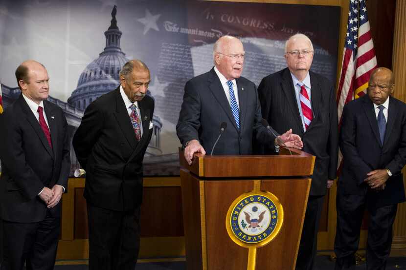 From left: U.S. Sen. Chris Coons, Rep. John Conyers, Sen. Patrick Leahy, Rep. Jim...