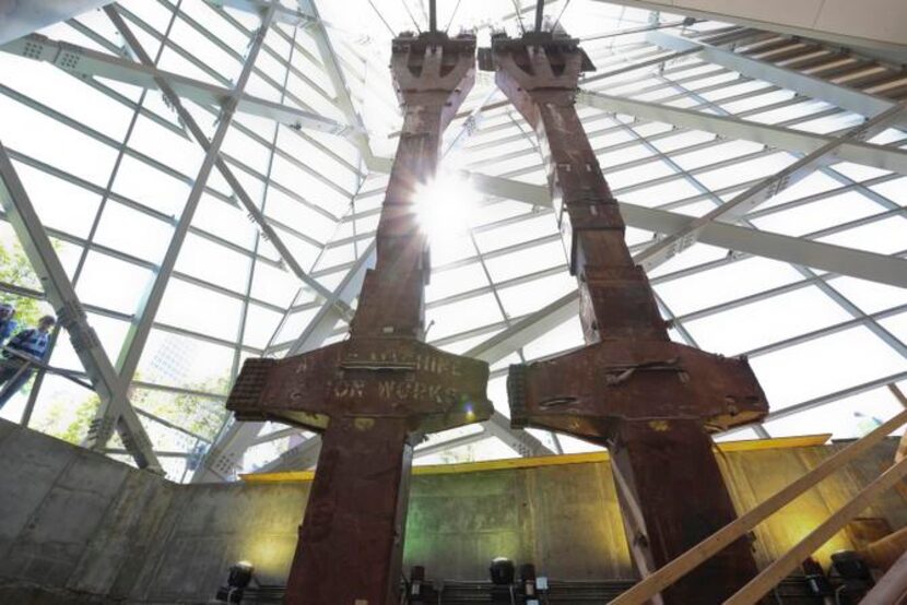 
The atrium of the museum features two forked steel beams, each more than seven stories...