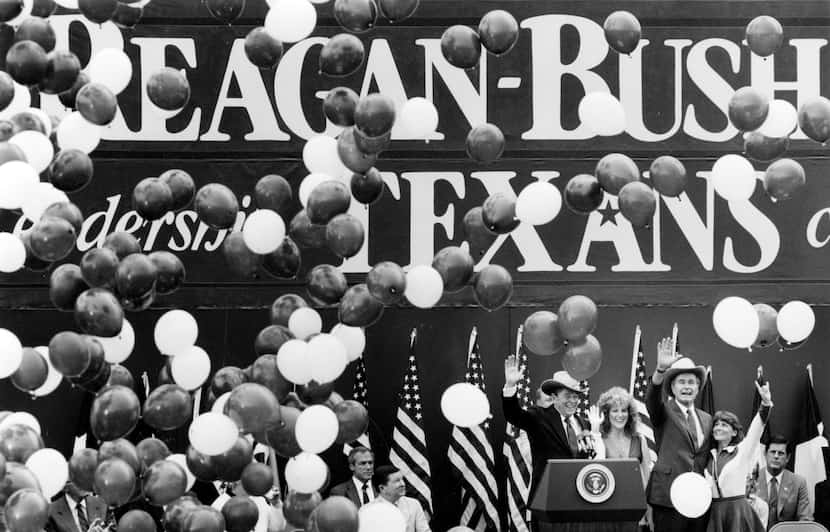 1984: President Ronald Reagan and Vice President George H. W. Bush wave to a crowd of...