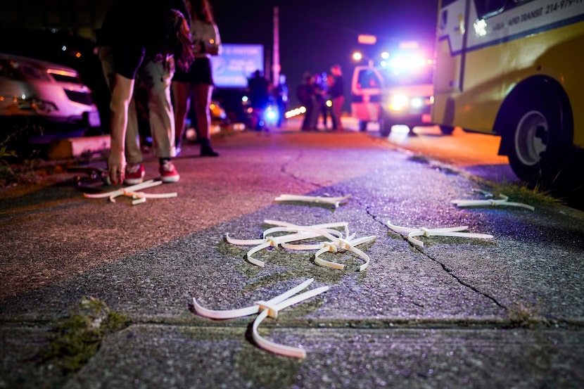 Disposable cuffs litter the sidewalk as protesters are released outside the Frank Crowley...