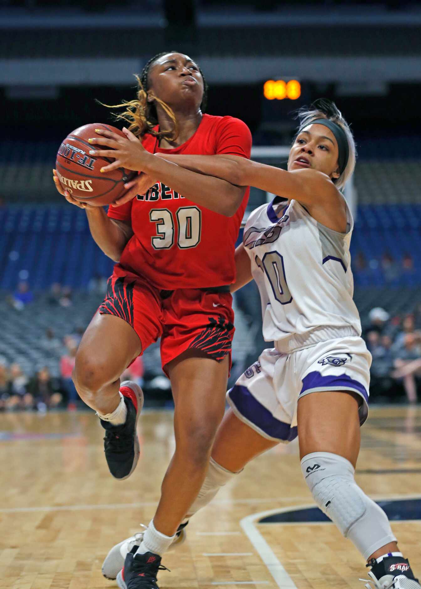 Frisco Liberty Jazzy Owens-Barnett is foxed by College Station guard Mia Rivers #10 in the...