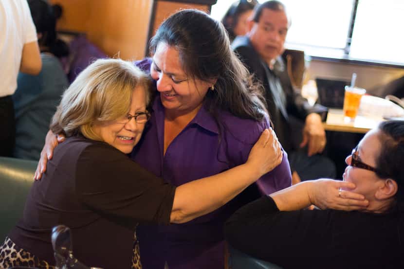 Julia Suarez-Macias (left) hugs Monica Alonzo, Dallas City Councilwoman representing...