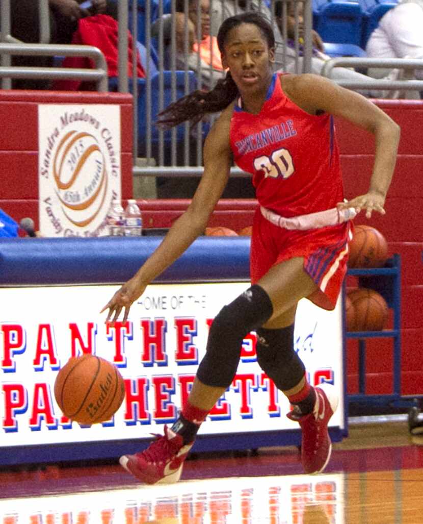 Duncanville guard Zarielle Green (00) rambles down the court after a first half steal...