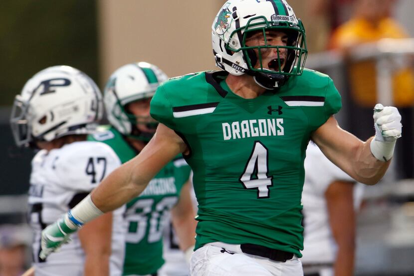 FILE - Southlake Carroll running back T.J. McDaniel (4) lets out a yell after igniting a...