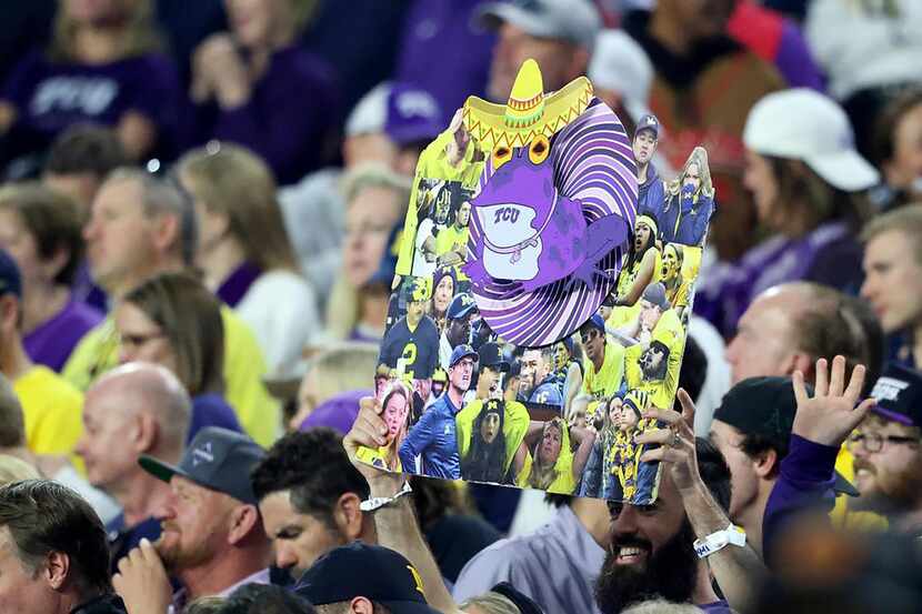 A TCU fan holds up a hypnotoad at the Vrbo Fiesta Bowl at State Farm Stadium on Dec. 31,...