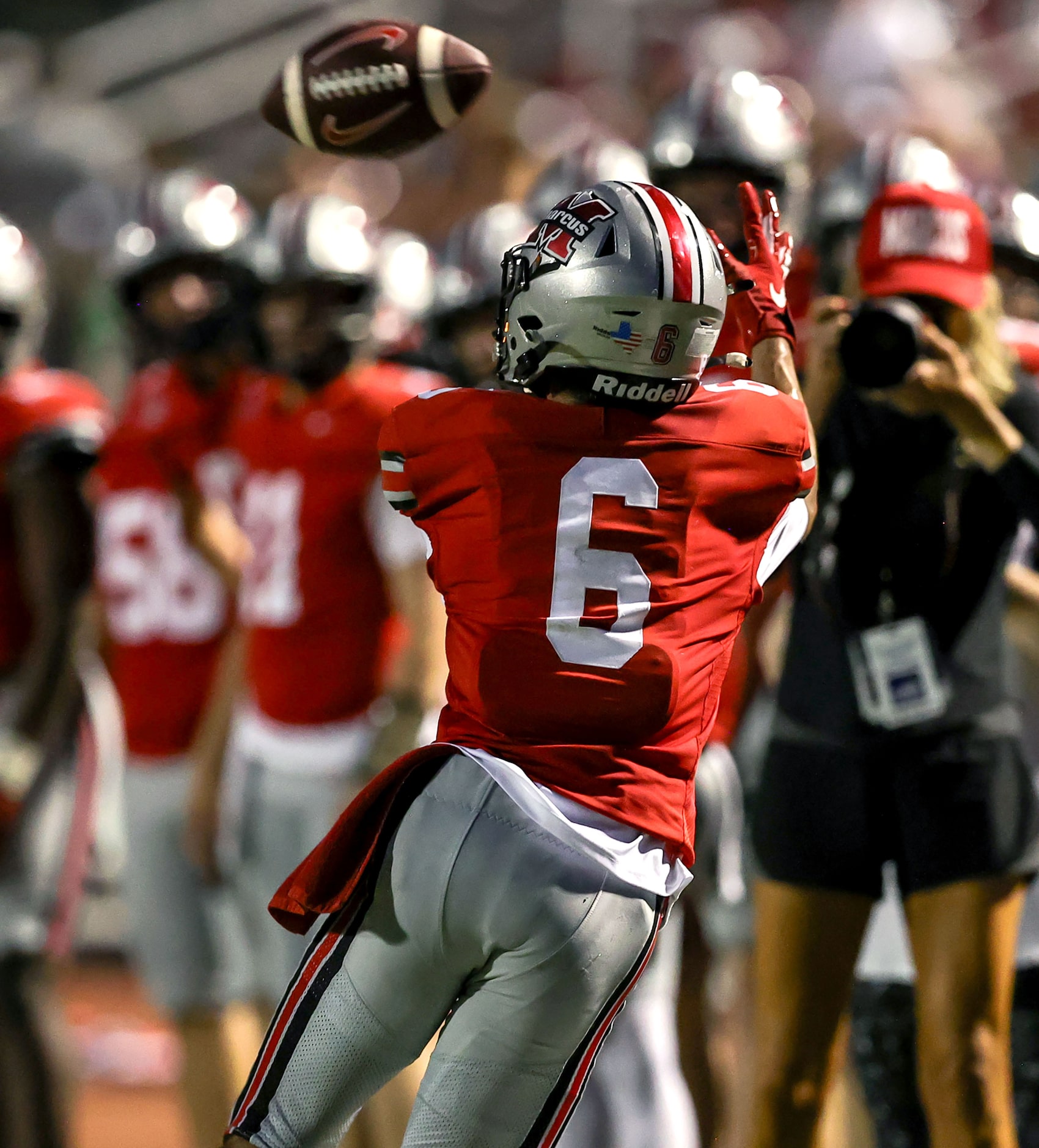 Flower Mound Marcus wide receiver Rhett Garza (6) tries to come up with a reception against...