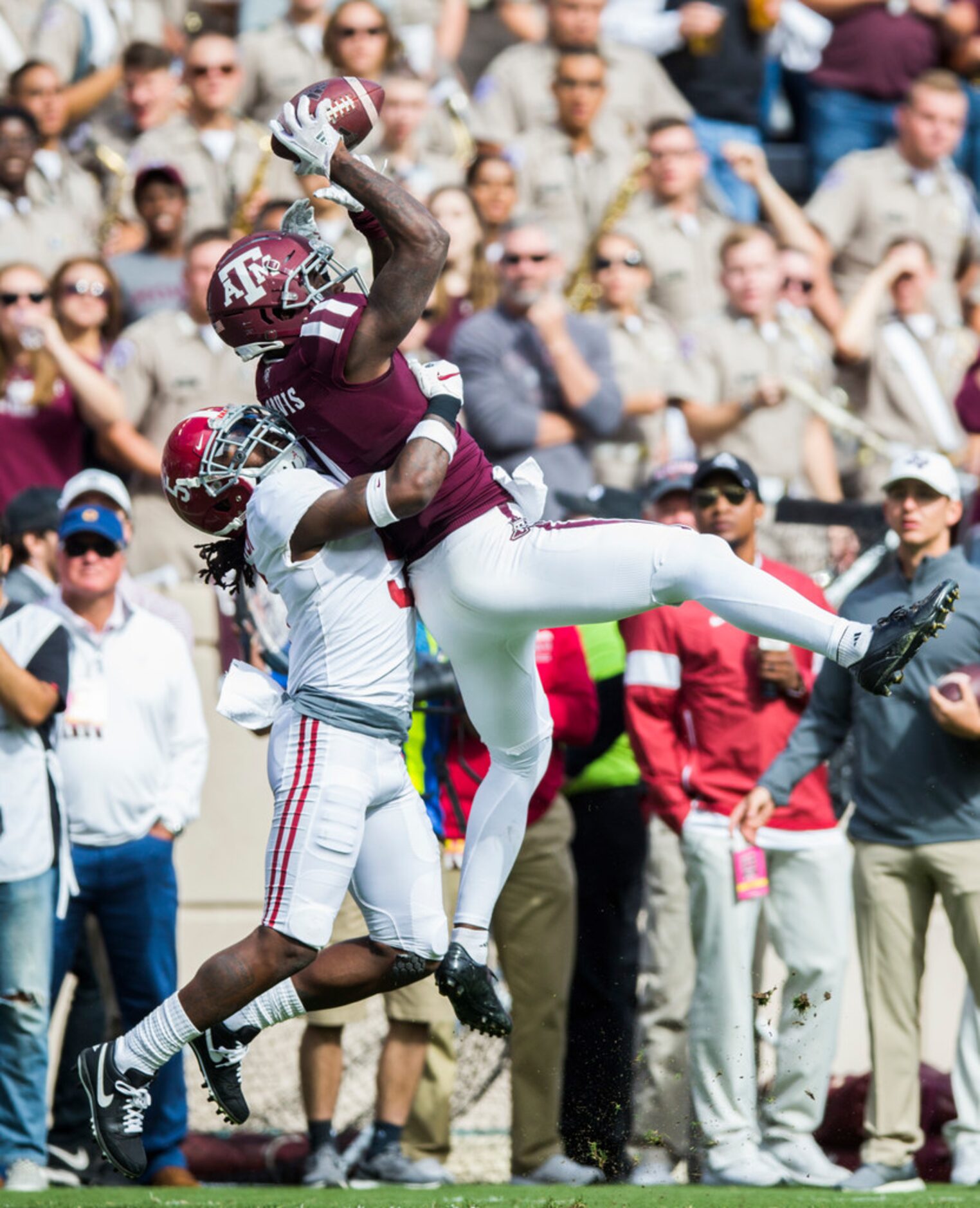 Texas A&M Aggies wide receiver Quartney Davis (1) catches a pass over Alabama Crimson Tide...