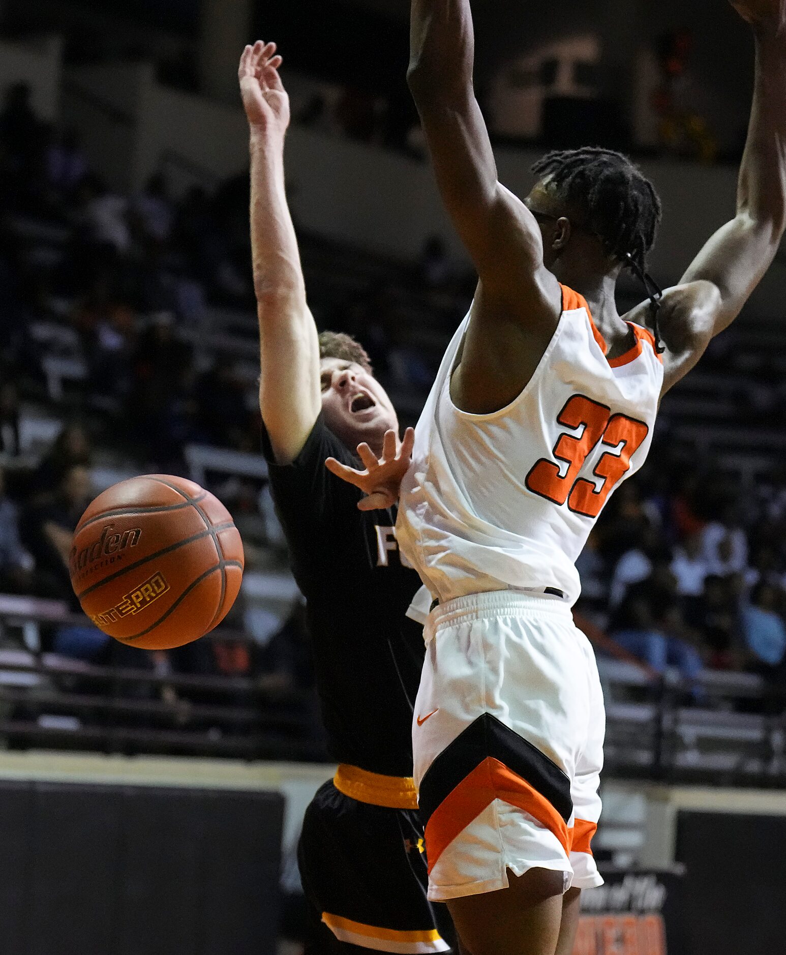 Forney’s Ayden McDonald (5) loses the ball as he tries to drive around Lancaster’s Amari...