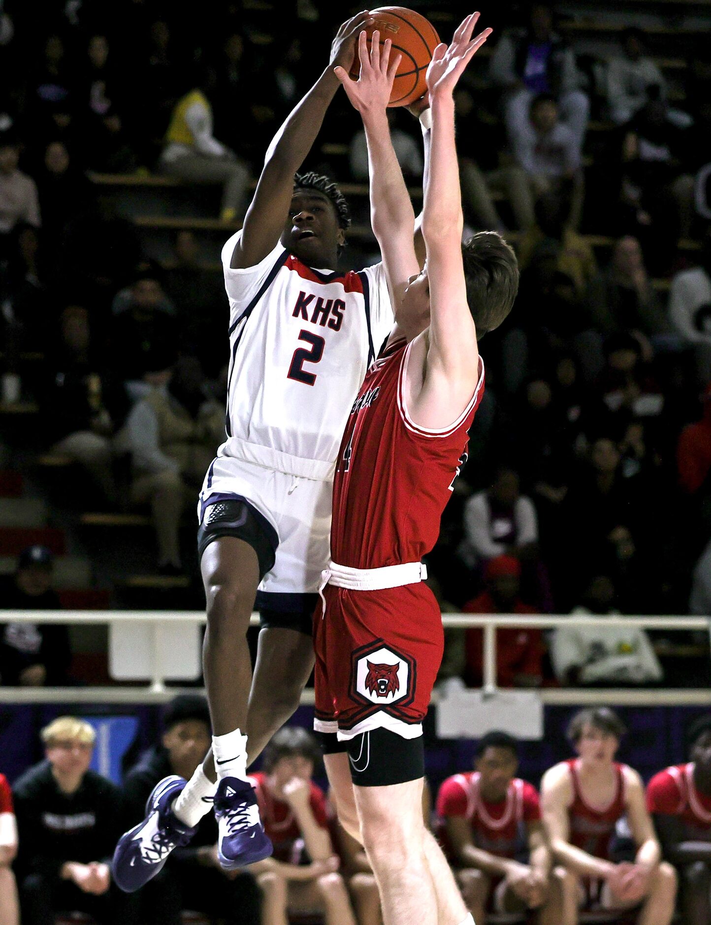 Kimball guard T'Johnn Brown (2) tries to get a shot off over Woodrow Wilson forward Brian...