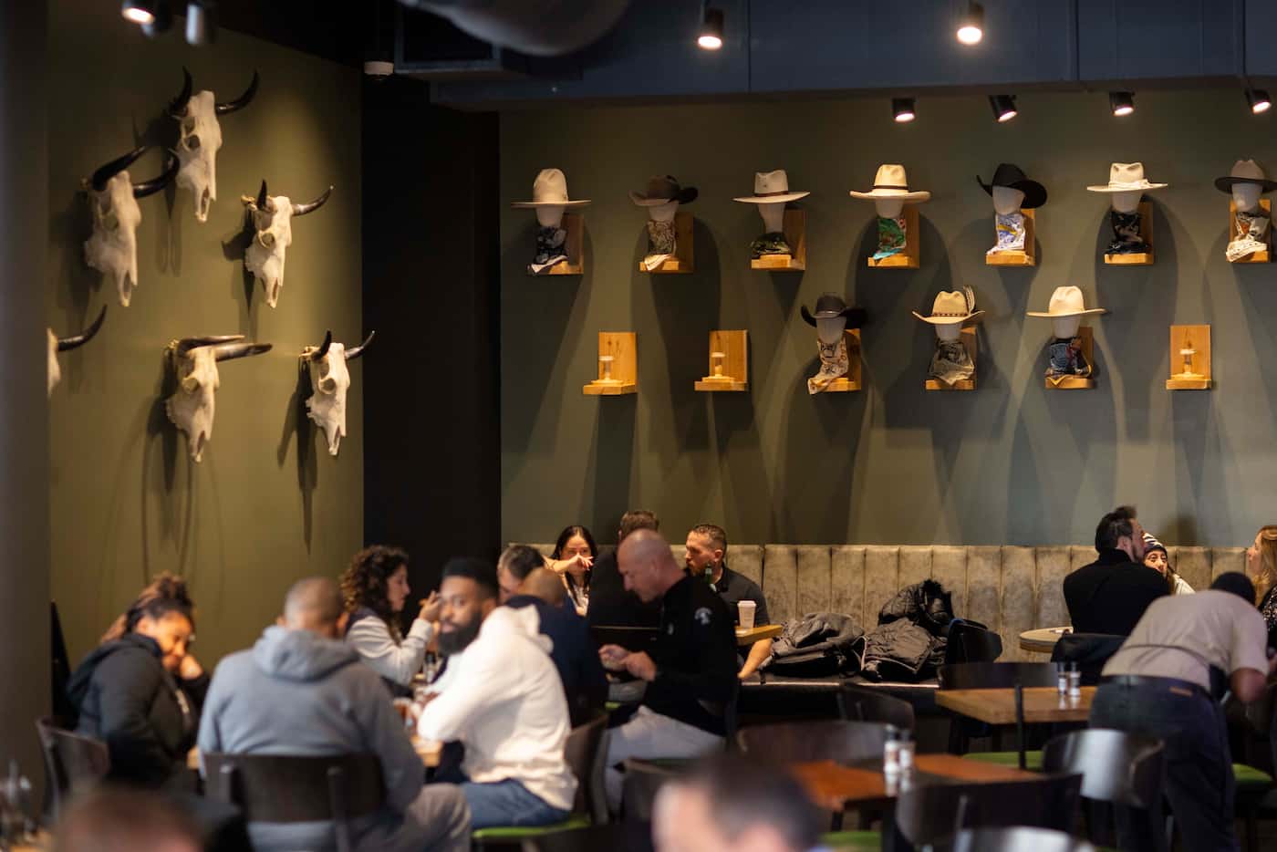Skulls and cowboy hats adorn the wall of the new Cowboy Chow restaurant at the AT&T...