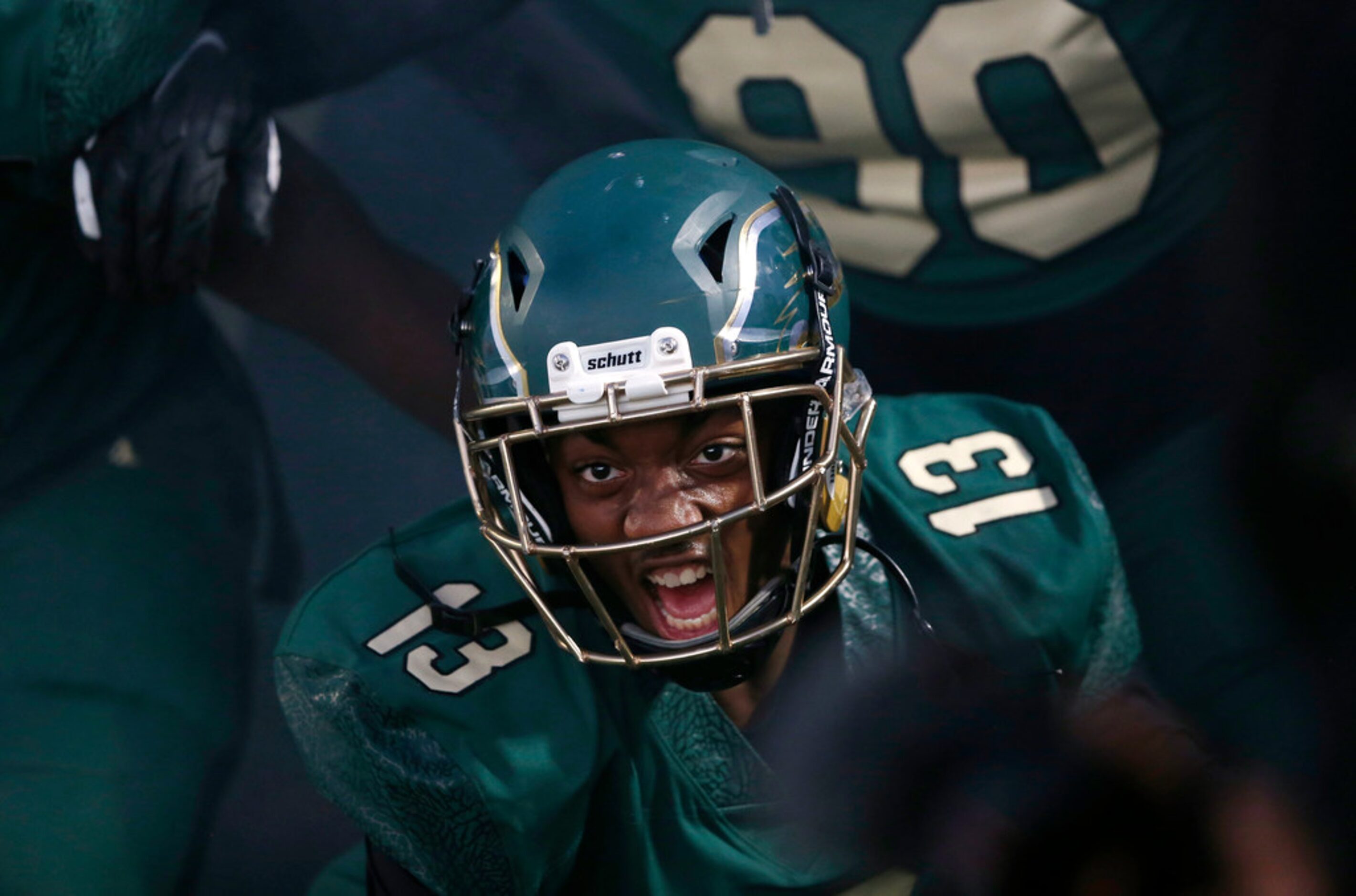 DeSoto's Tyre' Lindsey (13) screams as he prepares tot take the field with the team during...